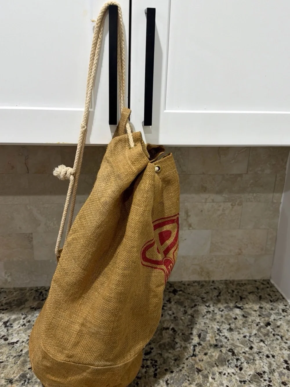 Tan Jute Drawstring Duffel Bag with Red Accent